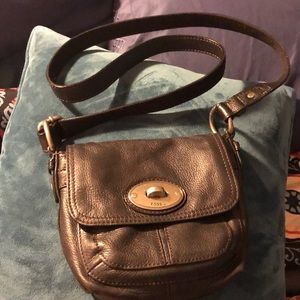 Small, genuine leather Fossil crossbody bag.